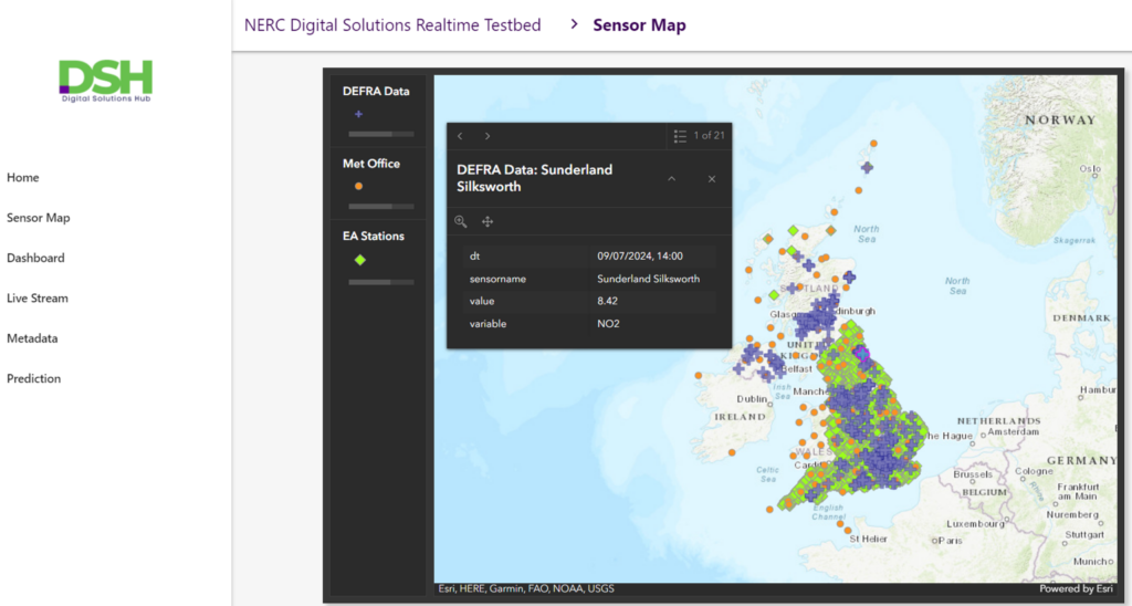 The screenshot is of the Digital Solutions Hub realtime testbed that shows a map of the UK and Ireland in the majority of the image. On the UK there are multiple green, orange and purple dots that represent different sensors for DEFRA, the Met Office and the Environment Agency. There is a large cluster around England, with only Met Office sensors dotted across Wales. Scotland has a large cluster of DEFRA data sensors in the Glasgow to Edinburgh area with other sensors from all sources dotted across the rest of Scotland and up to the islands. There are some DEFRA and Met Office sensors in Northern Ireland, and one Met Office centre on each of Guernsey and Jersey. There is also 2 Met Office stations in Ireland.